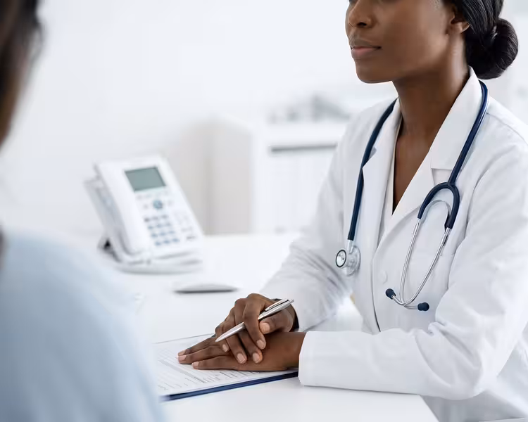 Getting Ready for a Smooth and Dignified Arrival: A doctor and patient during a consultation Doctor and patient consultation for Getting Ready for a Smooth and Dignified Arrival - Hearing First St Albans: Lift Access...